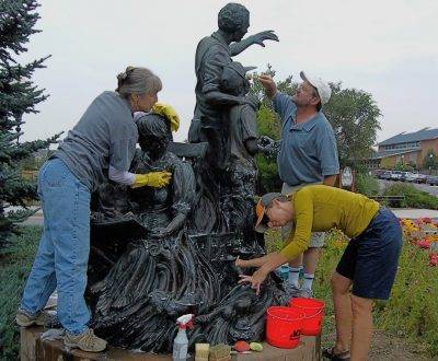 Restore Art. Outdoor bronze maintenance. Washing and waxing bronze sculpture.